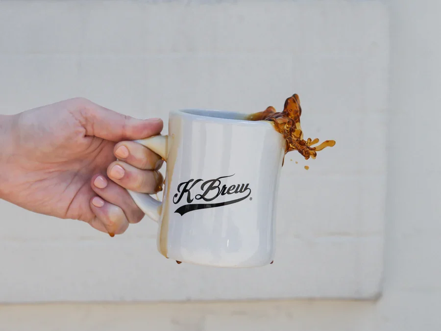 holding kbrew coffee mug
